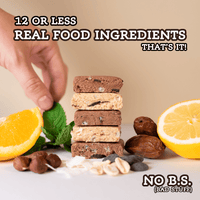 Stack of naked All Real Protein Bars with fruits and nuts on a light background, emphasizing real food ingredients.