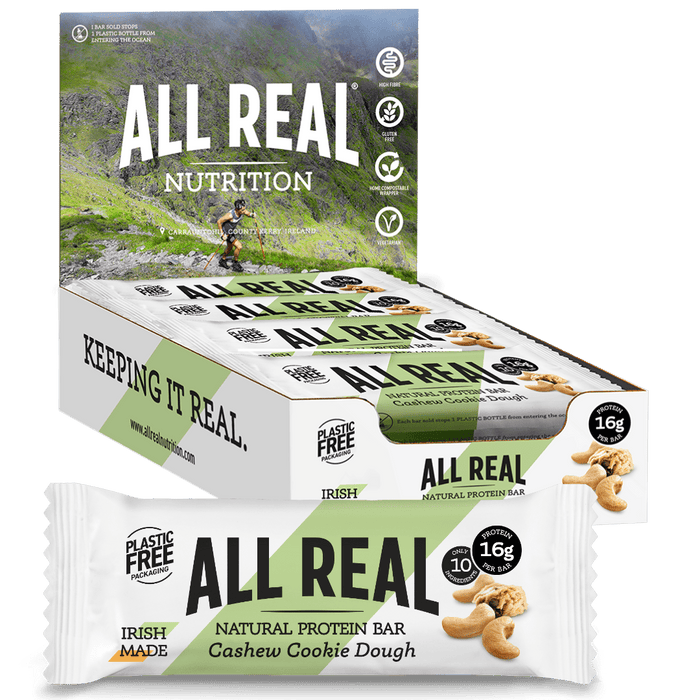 Packaging of All Real Nutrition Cashew Cookie Dough Protein Bars showing the box with bars inside and the front of a single bar with 16g protein listed.