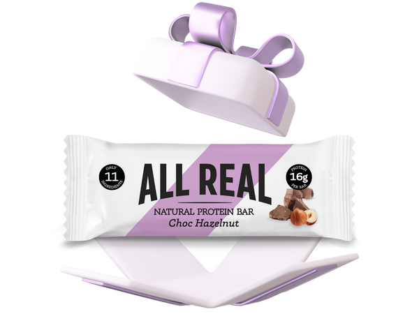 All Real protein bar with a decorative box on a white background