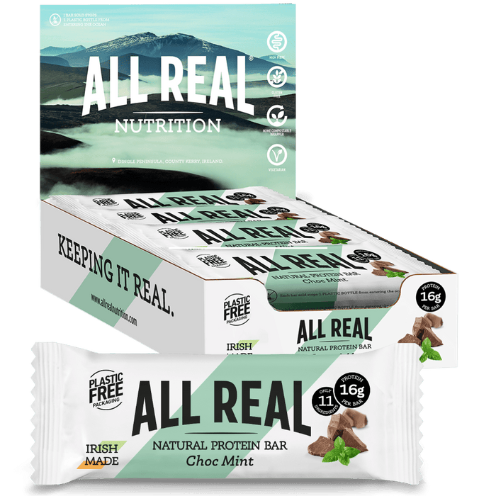 A box of All Real natural protein bars in Choc Mint flavor, with individual bars visible showing the texture and chocolate mint chips.
