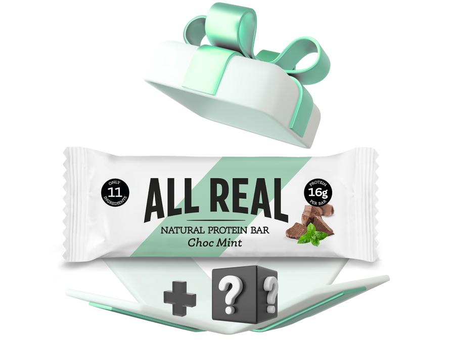 All Real protein bar with a gift box and red ribbon on a white background