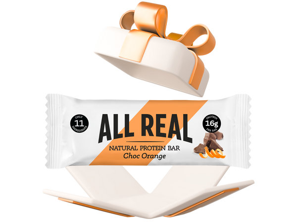 All Real protein bar in a red gift box on a white background