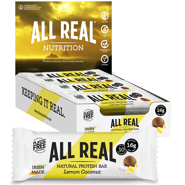 Packaging of All Real Natural Protein Bar in Lemon Coconut flavor, highlighting the bar's features like being made with real ingredients, gluten-free, and having 16g of protein.
