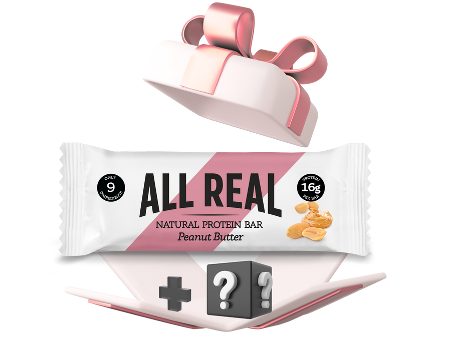 All Real Natural Protein Bar packaging with a pink ribbon on a white background