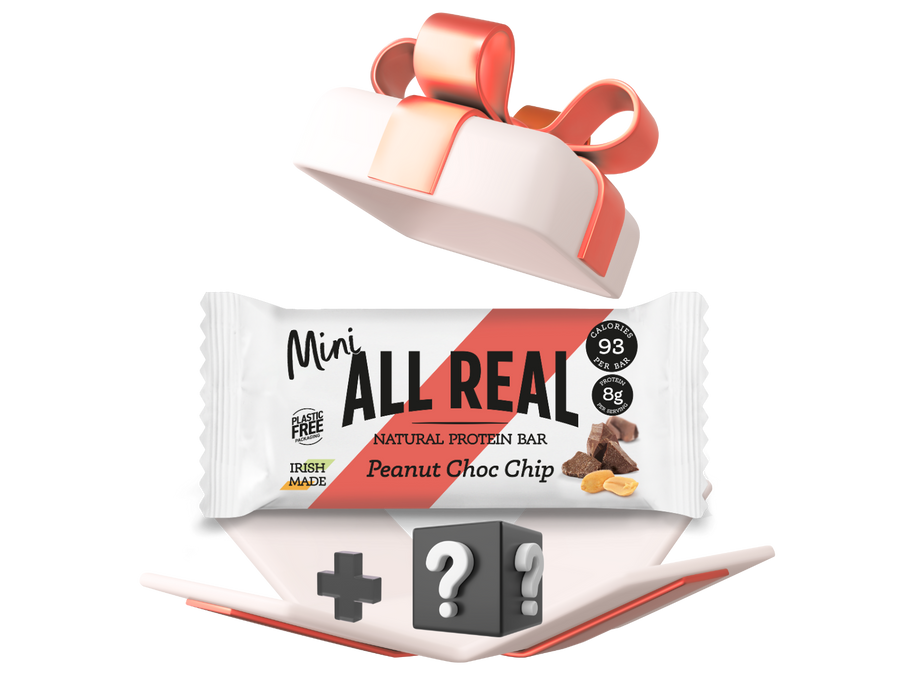All Real protein bar with a red gift box on a white background