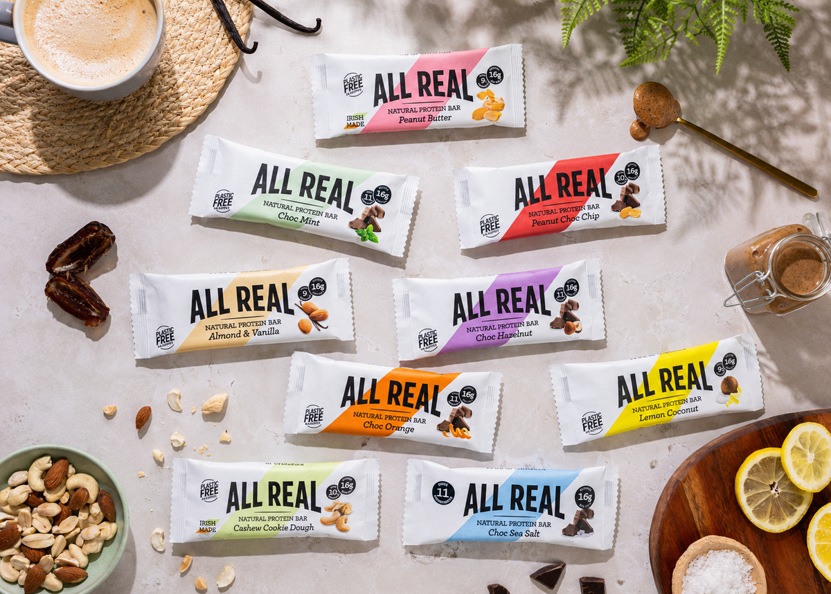 All Real protein bars arranged with real ingredients