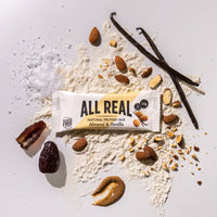 All Real almond vanilla protein bar with almonds and vanilla pods on ingredient background