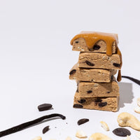 All Real cashew cookie dough protein bar stack with cashews